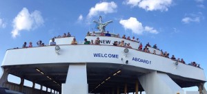 Foot passengers take in the view from the ferry New Jersey.