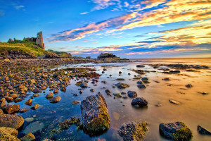 Dunure Castle, Scotland. Photo by Oliver Clarke, Flickr.