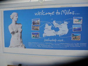 Sign at the harbor welcoming visitors to the island where the Venus de Milo was found. Photo by Clark Norton 