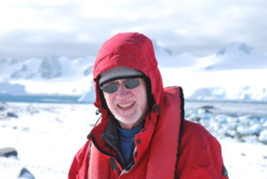 The author in Antarctica, having spun the globe at an angle. Photo by Catharine Norton. 