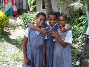 Fijian schoolgirls are happy, too -- as school adjourns for the day. Photo by Clark Norton