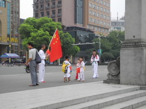 Kids preparing for a parade in Yichang, China. Photo by Catharine Norton. 