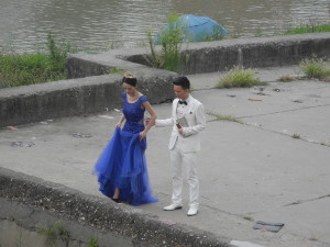 Couple poses for wedding pictures along the Yangtze in Yichang, China. Photo by Catharine Norton. 