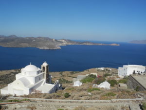 A whitewashed church overlooks Milos' harbor. Photo by Catharine Norton