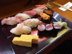 The sushi is fresh and delicious at the fish market. 