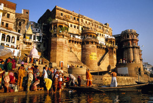 The ghats of Varanasi, with pilgrims, in early morning light. Photo by Dennis Cox/WorldViews