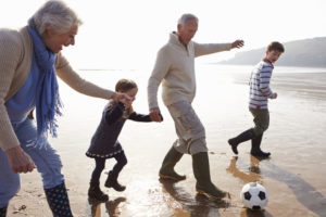 You might enjoy kicking a soccer ball with grandkids on a beach overseas. 