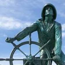 The Fisherman's Memorial "Man at the Wheel" overlooks the harbor. 