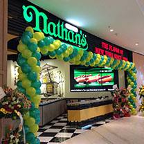 Where in Asia would you find this location of Nathan's Famous hot dogs? Photo from Nathan's Famous.