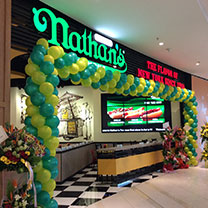 Where in Asia would you find this location of Nathan's Famous hot dogs? Answer: Malaysia. Photo from Nathan's Famous. 